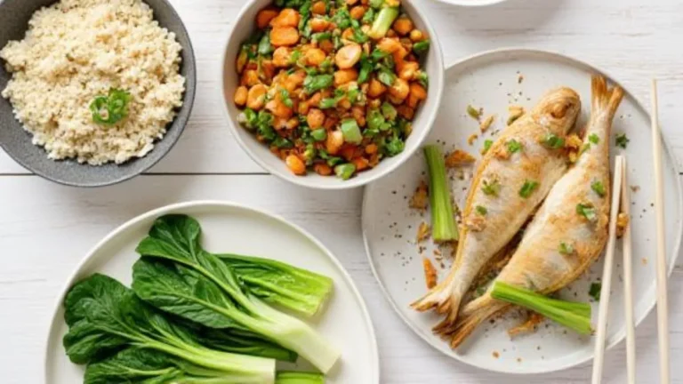 "Healthy Chinese recipes meal spread with steamed fish, cauliflower rice, and stir-fried bok choy"